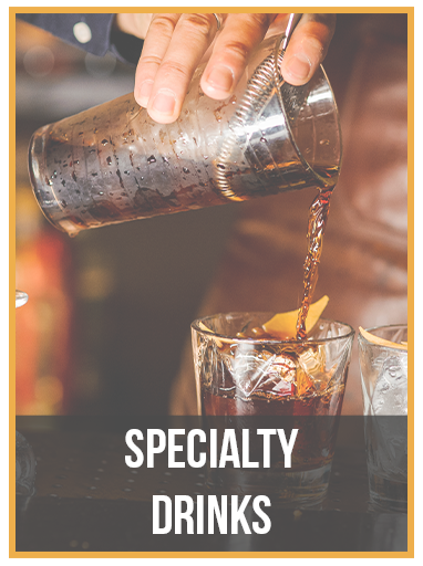 A bartender is pouring a drink into a glass.