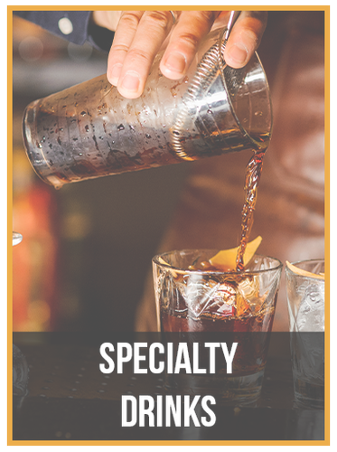 A bartender is pouring a drink into a glass.