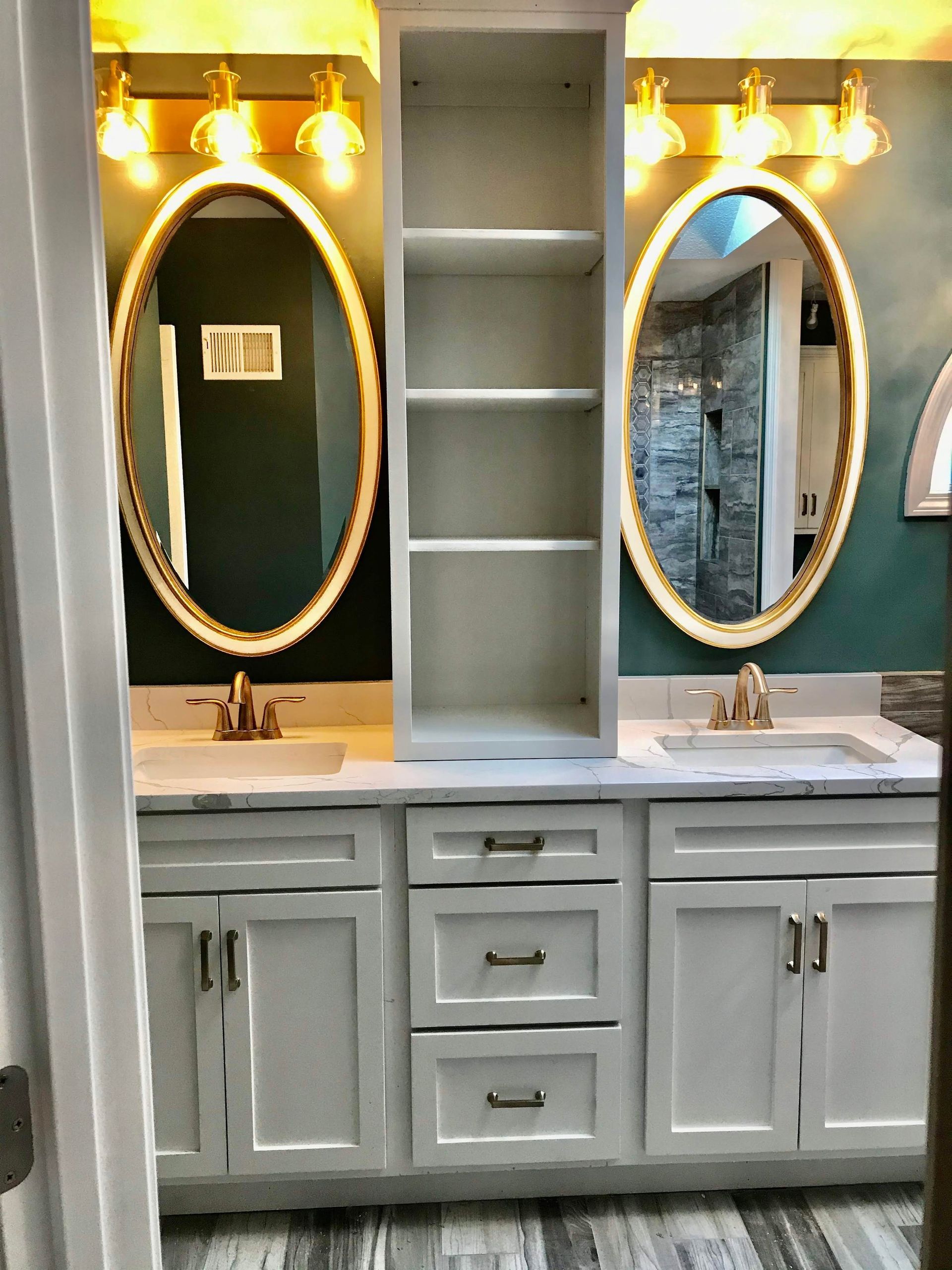 A bathroom with two sinks and two mirrors.