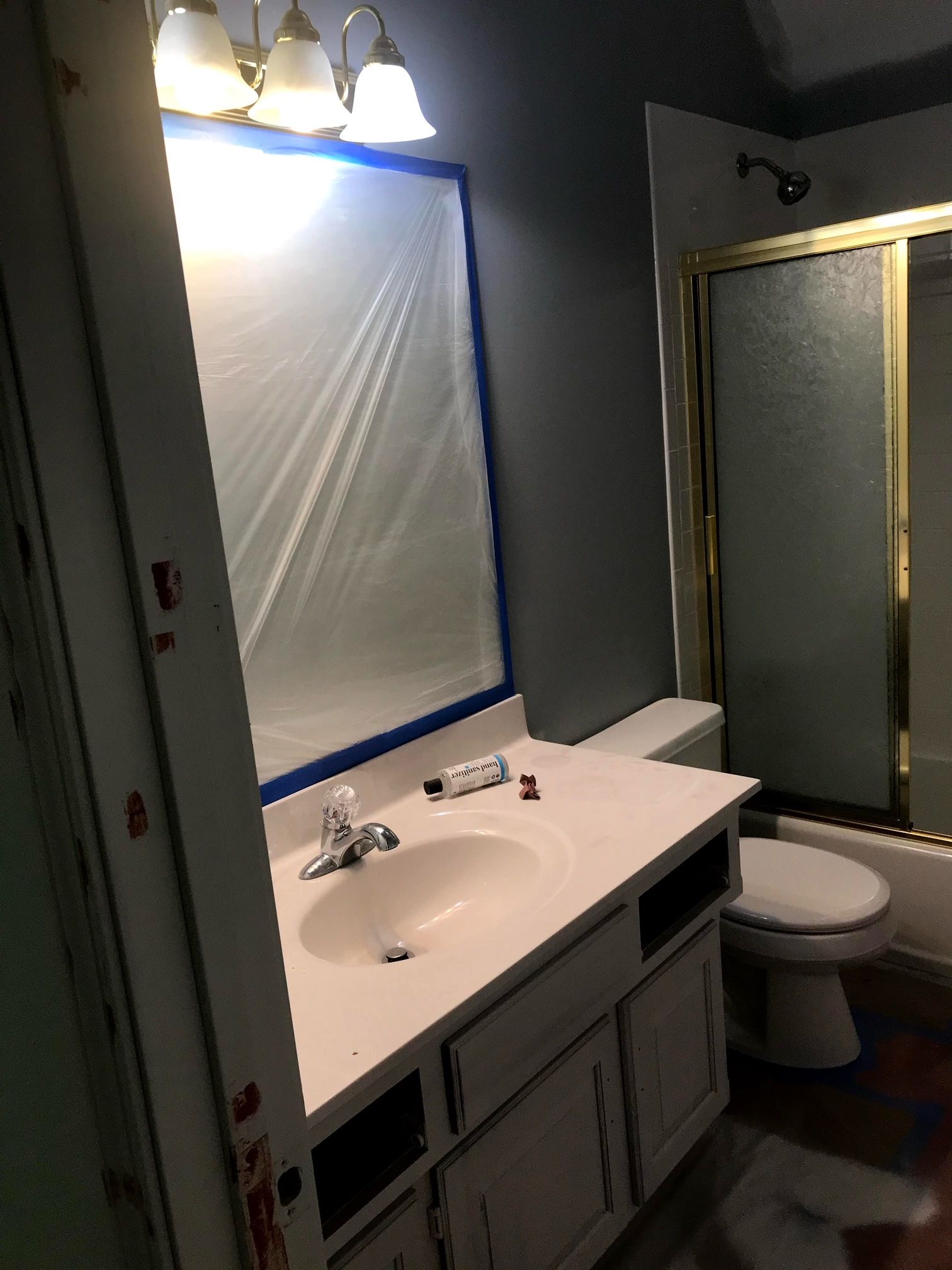 A bathroom with a sink , toilet , and shower.