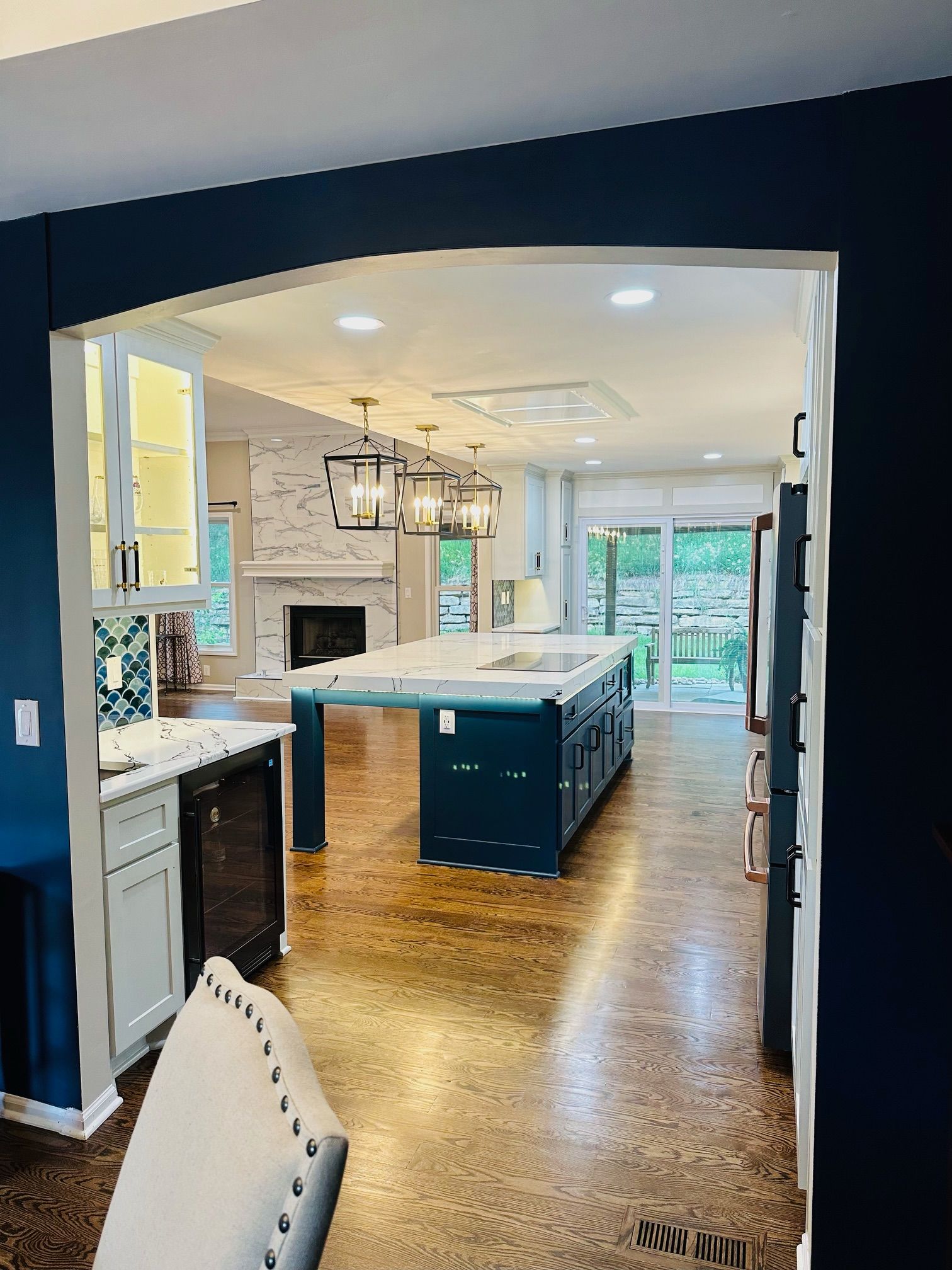 A kitchen with a large island in the middle of the room.