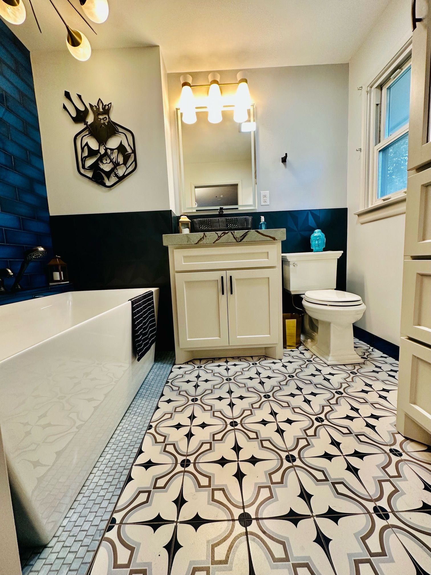 A bathroom with a sink , toilet , and bathtub.