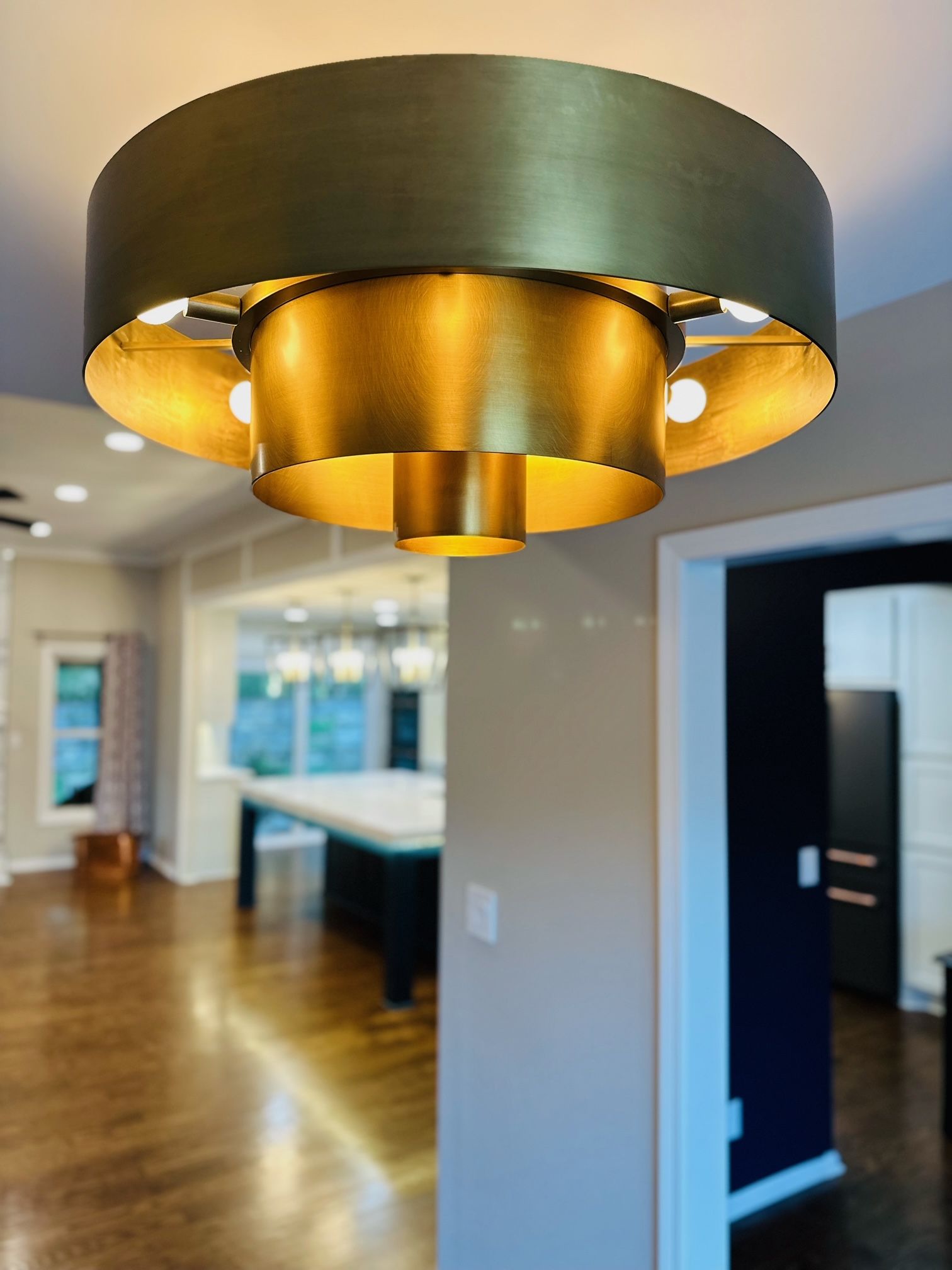 A ceiling light is hanging from the ceiling in a living room
