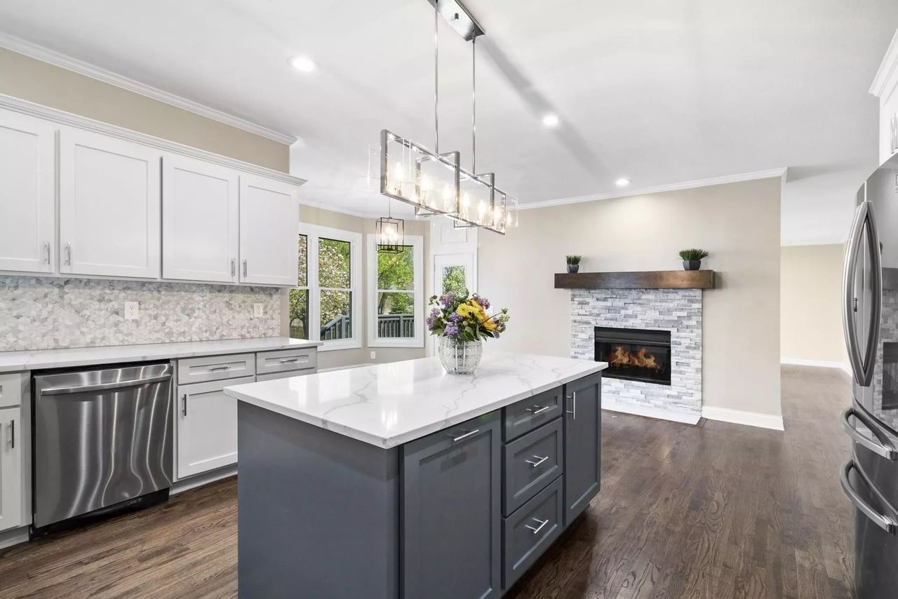 There is a large island in the middle of the kitchen.