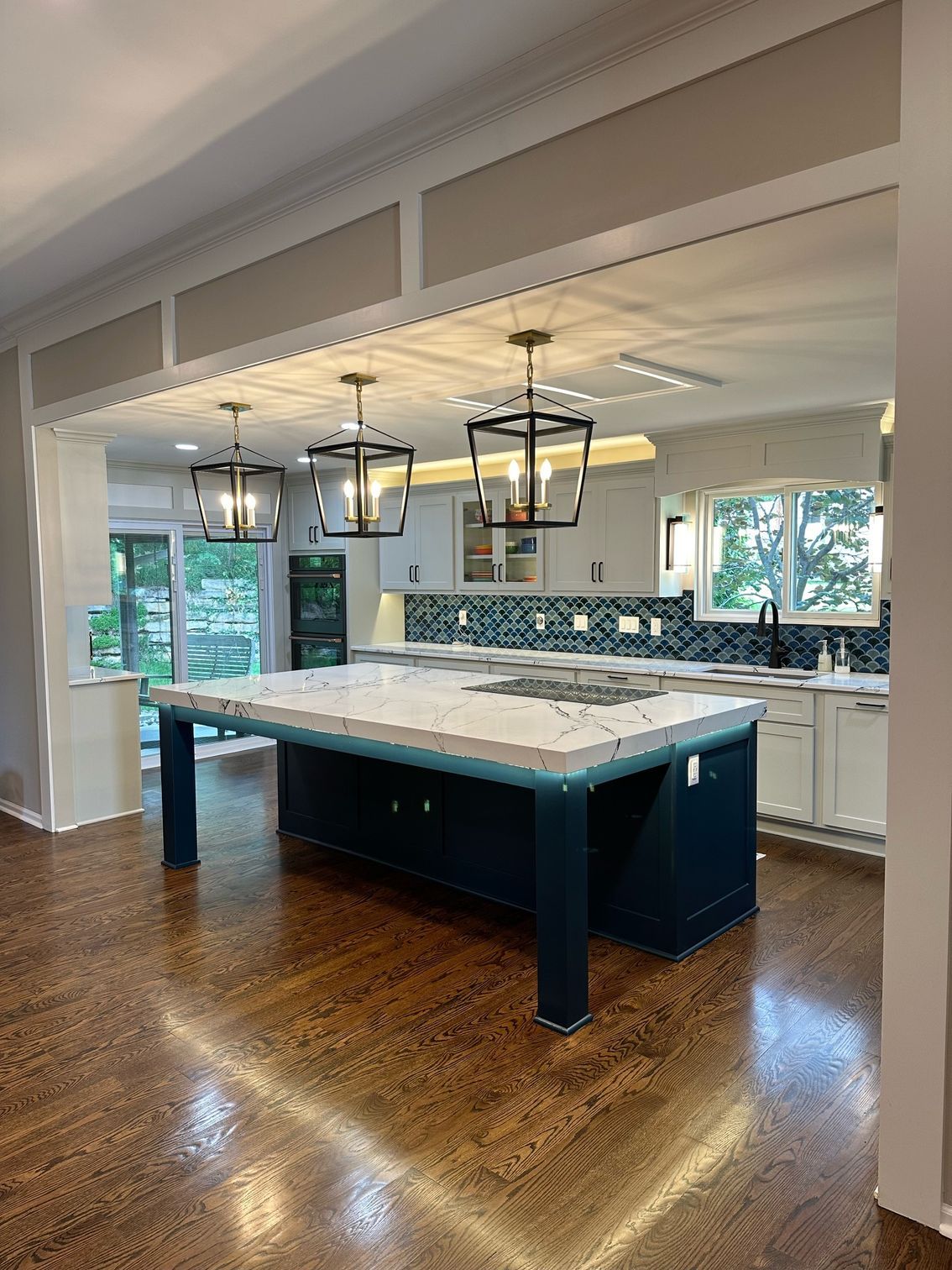 There is a large island in the middle of the kitchen.