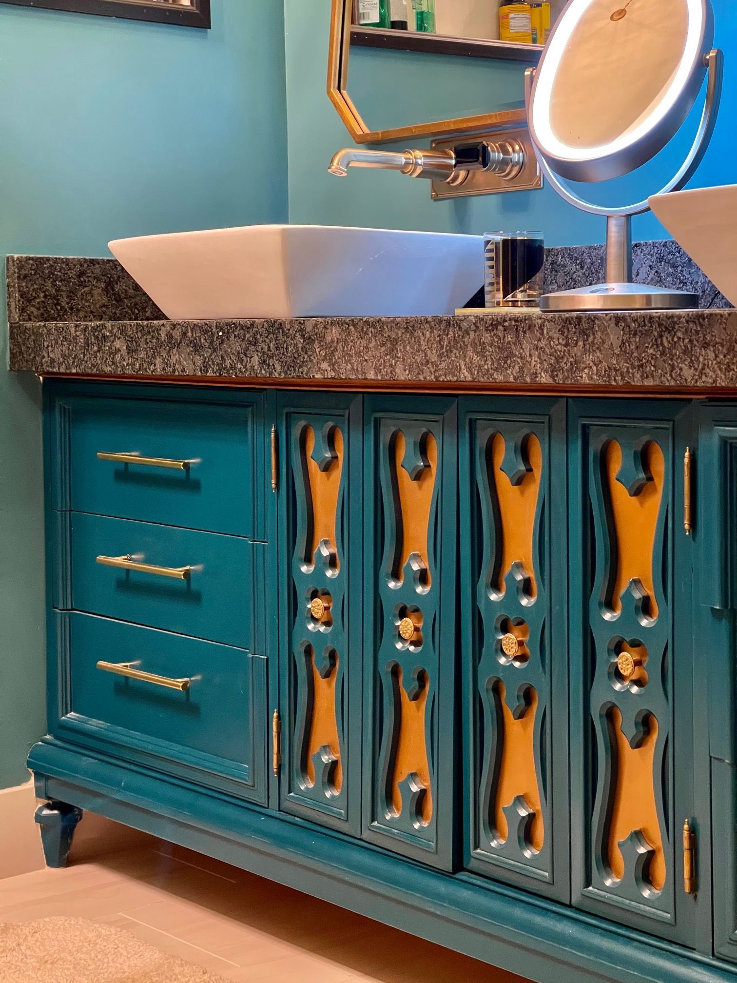 A bathroom with two sinks and a mirror