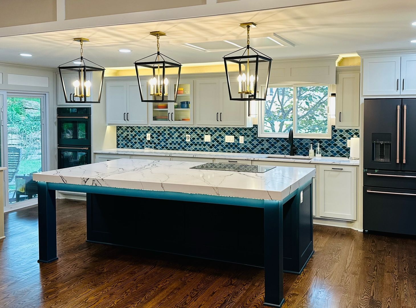 There is a large island in the middle of the kitchen.