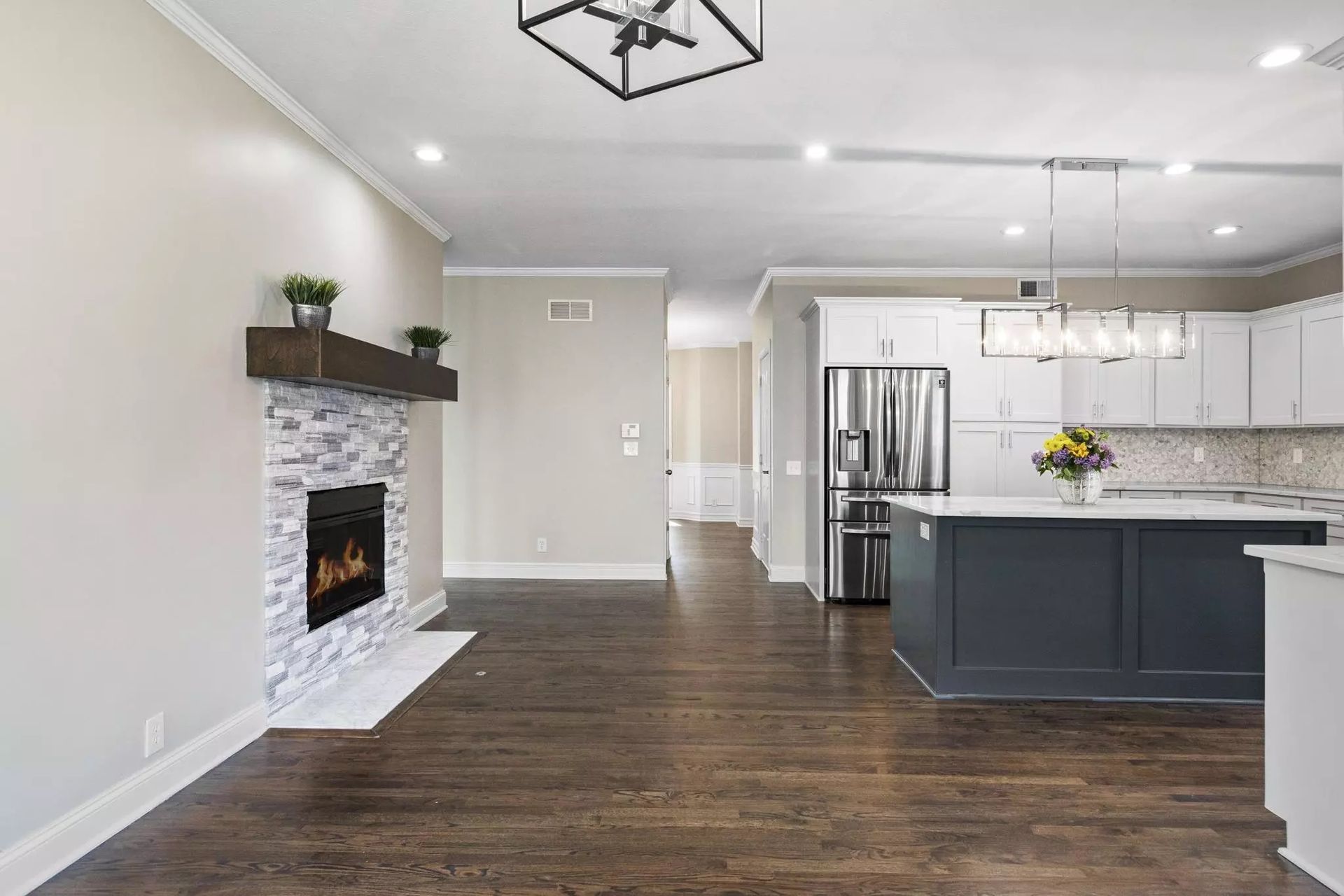 There is a fireplace in the middle of the living room.