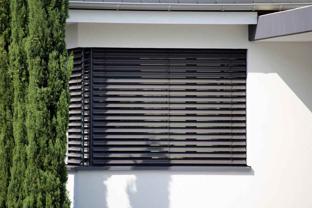Exterior Shot Of Window With Modern Blinds — Plantation Shutters in San Remo, NSW