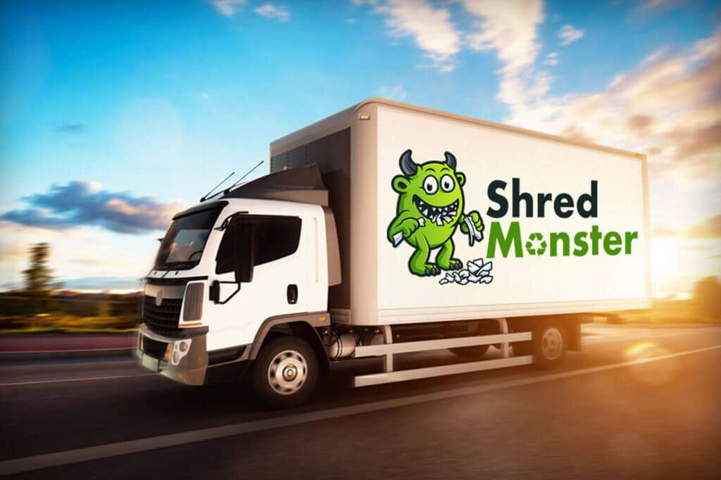 A shred monster truck is driving down a highway.