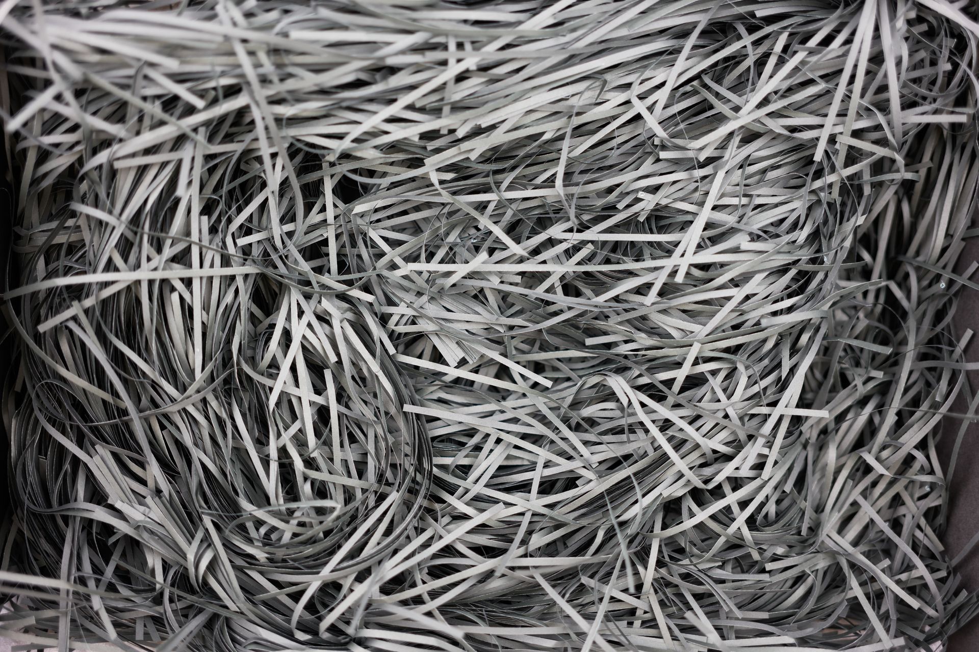 A black and white photo of a pile of shredded paper.