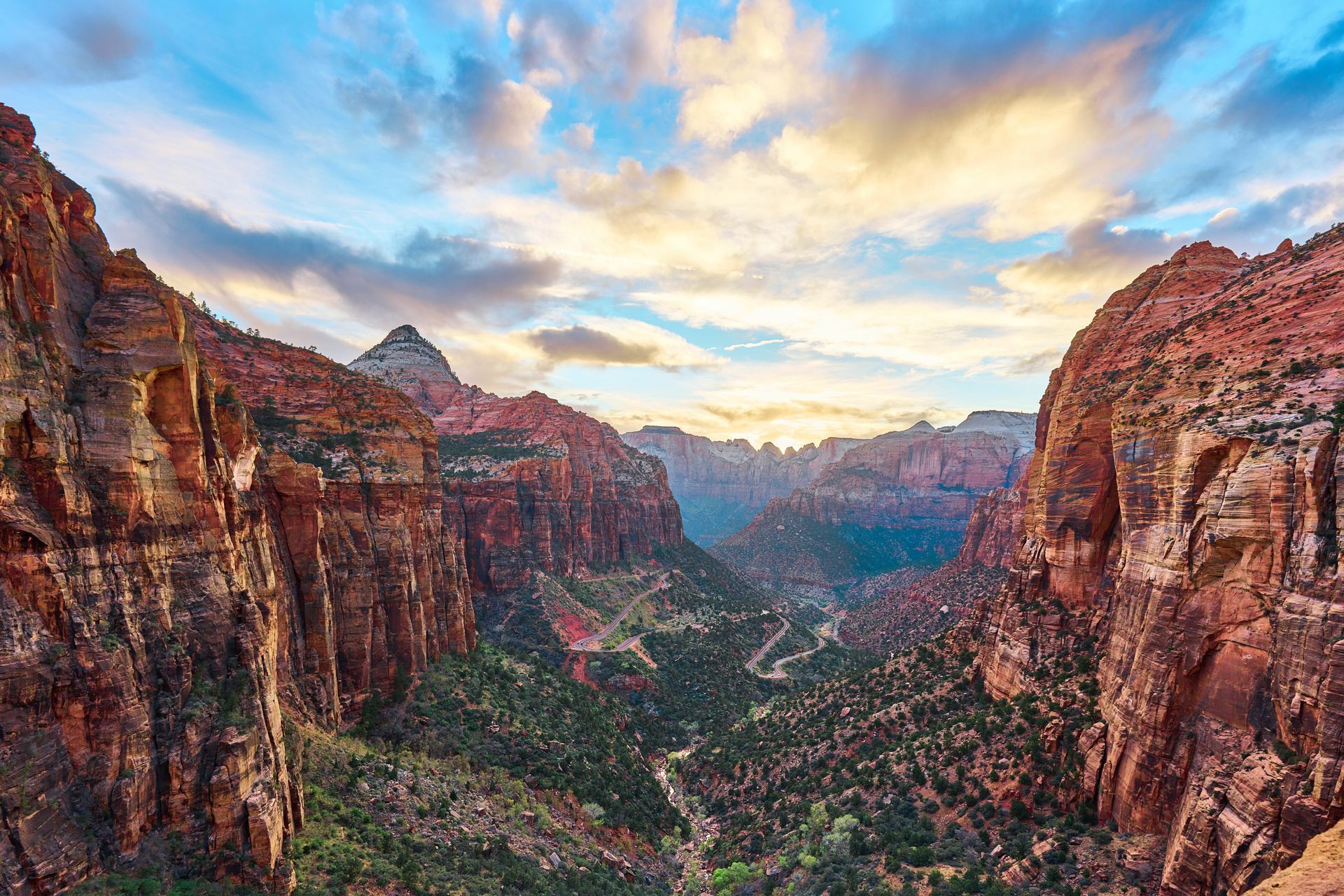 An aerial view of a canyon at sunset.