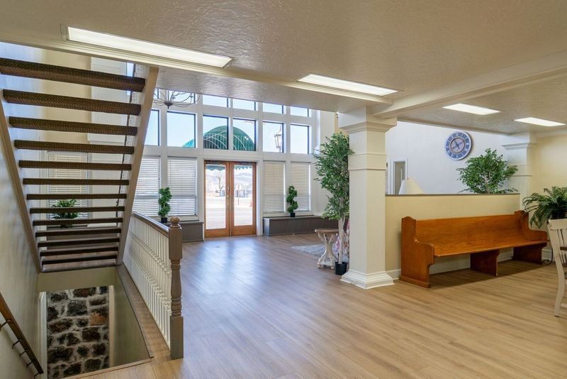 There is a wooden bench in the middle of the room.