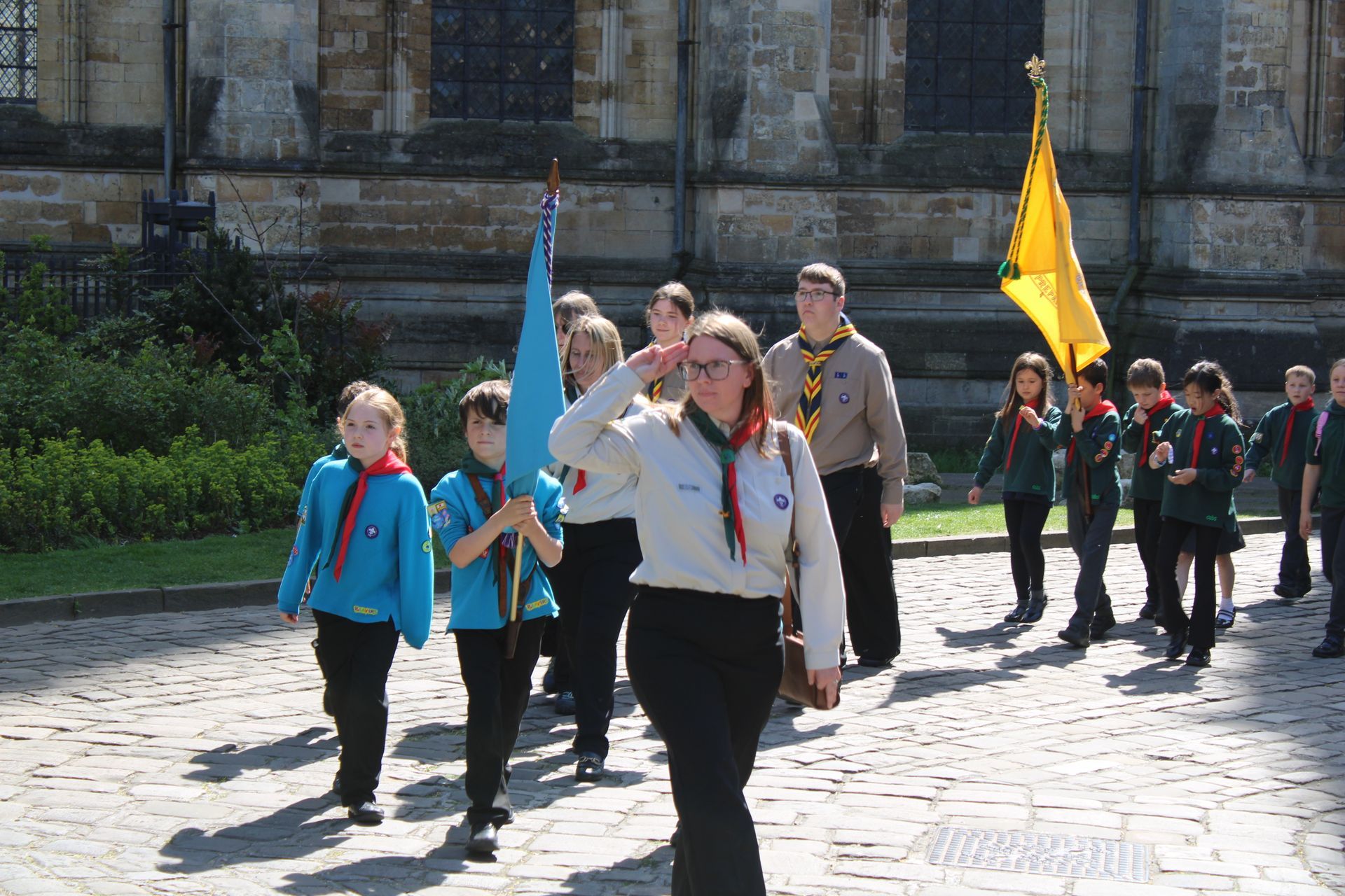 12th Lincoln Scouts saluting dignitaries outside Lincoln Cathedral during the St George’s Day parade.