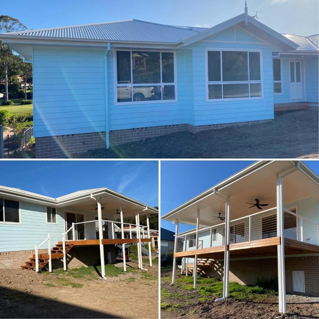 Blue House With White Trim and Deck Overlooking Yard — Mid North Coast Drafting & Construction in Taree, NSW