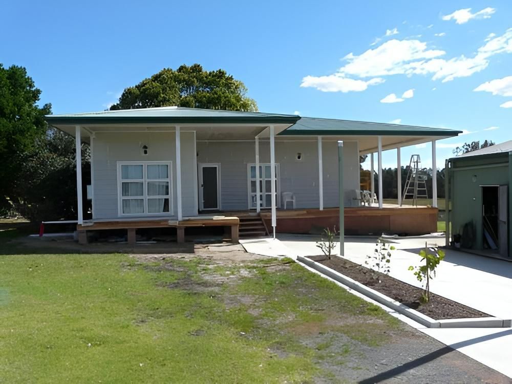 Single-Story House With Porch and Green Roof — Mid North Coast Drafting & Construction in Diamond Beach, NSW
