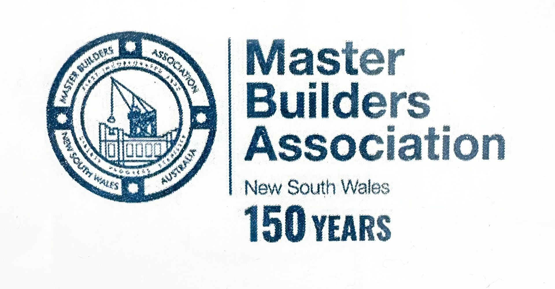 Master Builders Association logo: a blue emblem with a crane and building