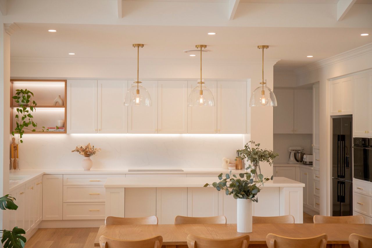 Bright White Kitchen With Wood Accents — Mid North Coast Drafting & Construction in Taree, NSW