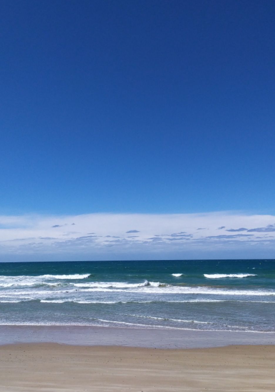 Sandy Beach Meeting Turquoise Ocean Under Blue Sky — Mid North Coast Drafting & Construction in Old Bar, NSW