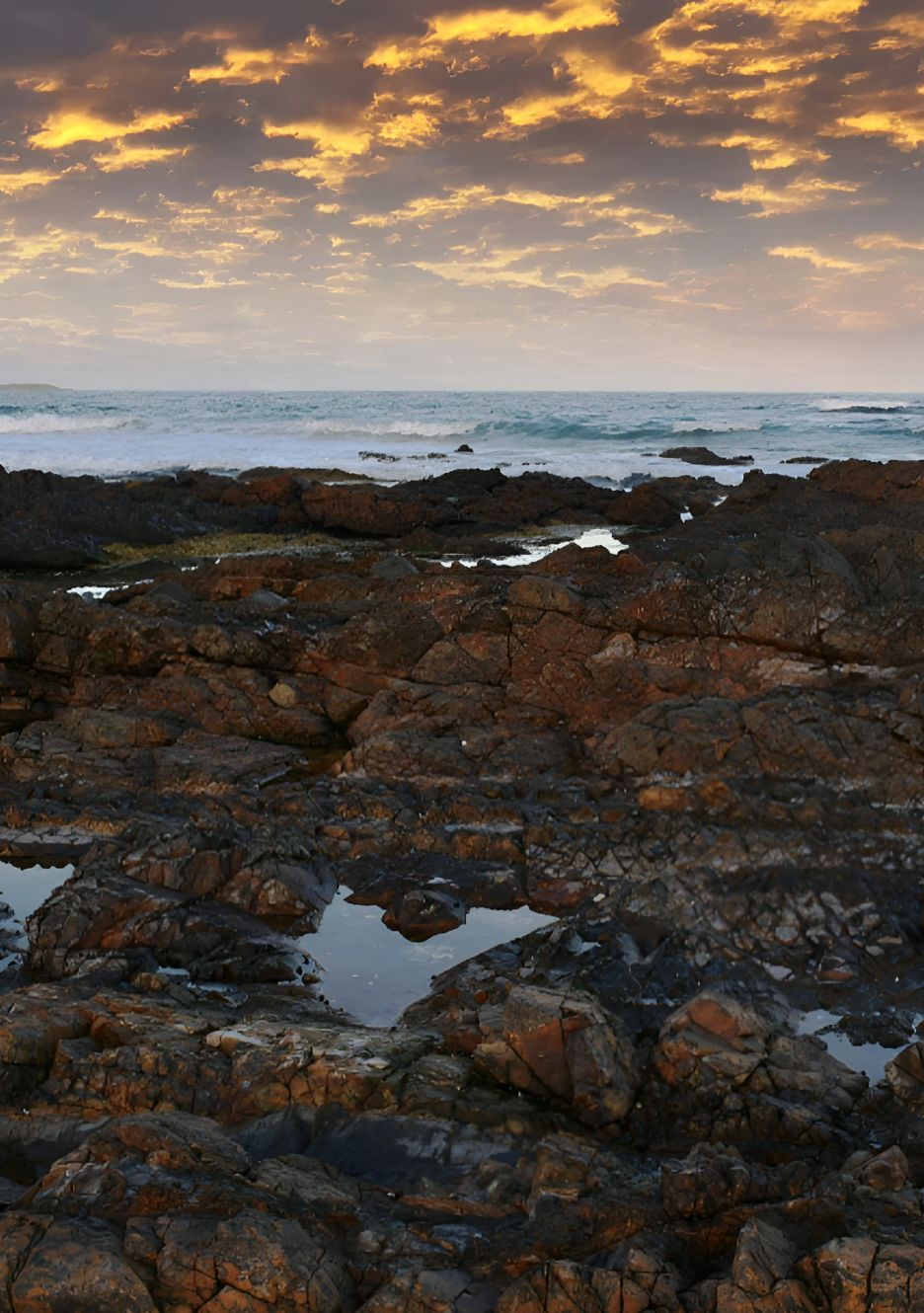 Rocky Shoreline With Tidal Pools and Sunset Sky — Mid North Coast Drafting & Construction in Diamond Beach, NSW