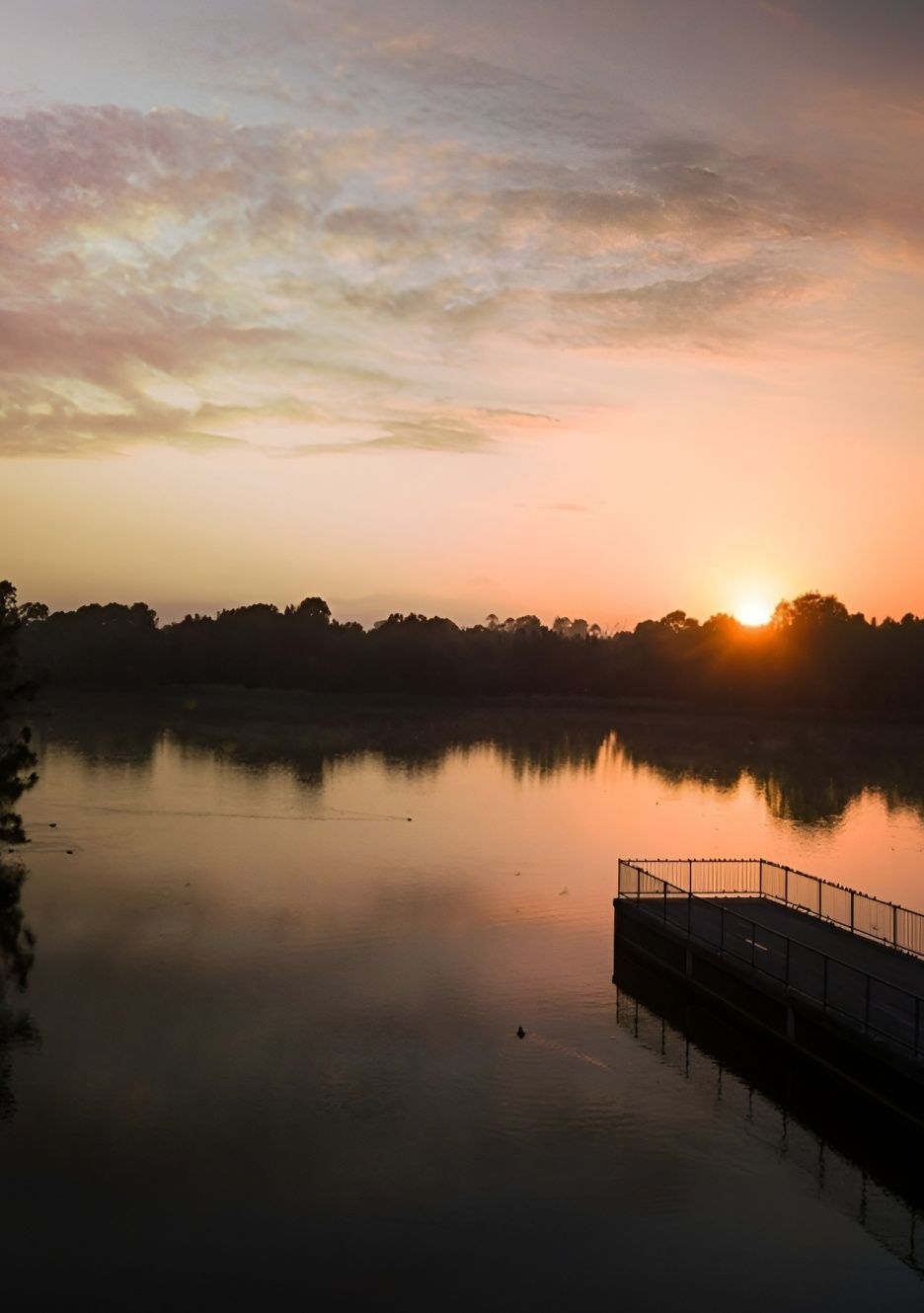 Sunrise Over Calm Lake With Pier and Silhouetted Trees — Mid North Coast Drafting & Construction in Harrington, NSW