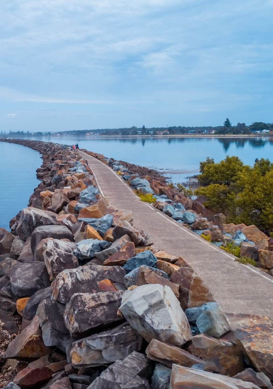 Stone Pathway Leading to Water Lined by Rocks — Mid North Coast Drafting & Construction in Harrington, NSW