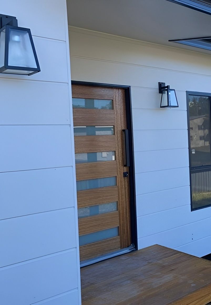 Wooden Door With Glass Panels and Black Hardware — Mid North Coast Drafting & Construction in Old Bar, NSW