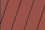 A close up of a red wooden surface with a diagonal pattern.