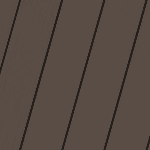 A close up of a brown wooden surface with black stripes.