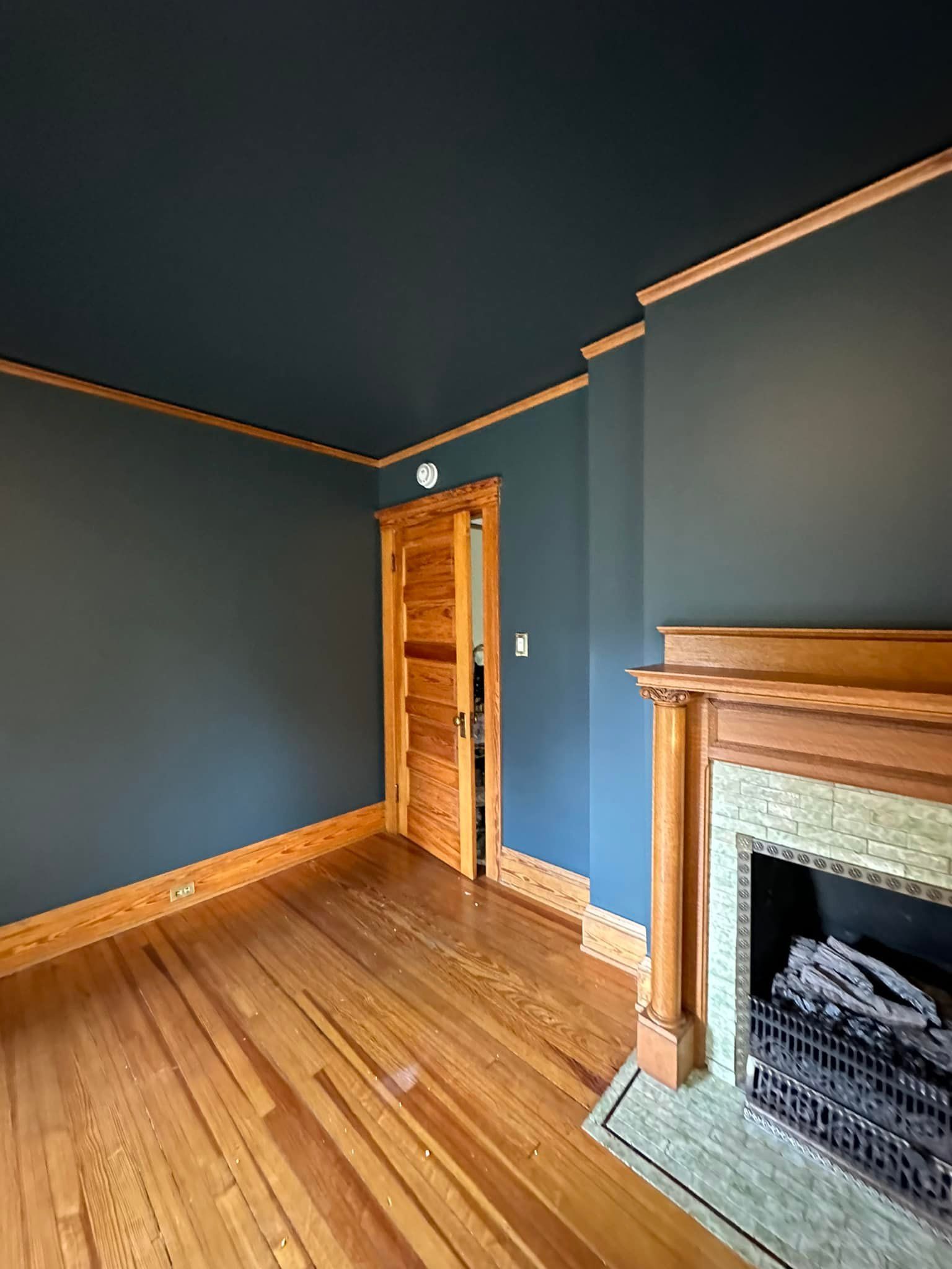 There is a fireplace in the middle of the room.