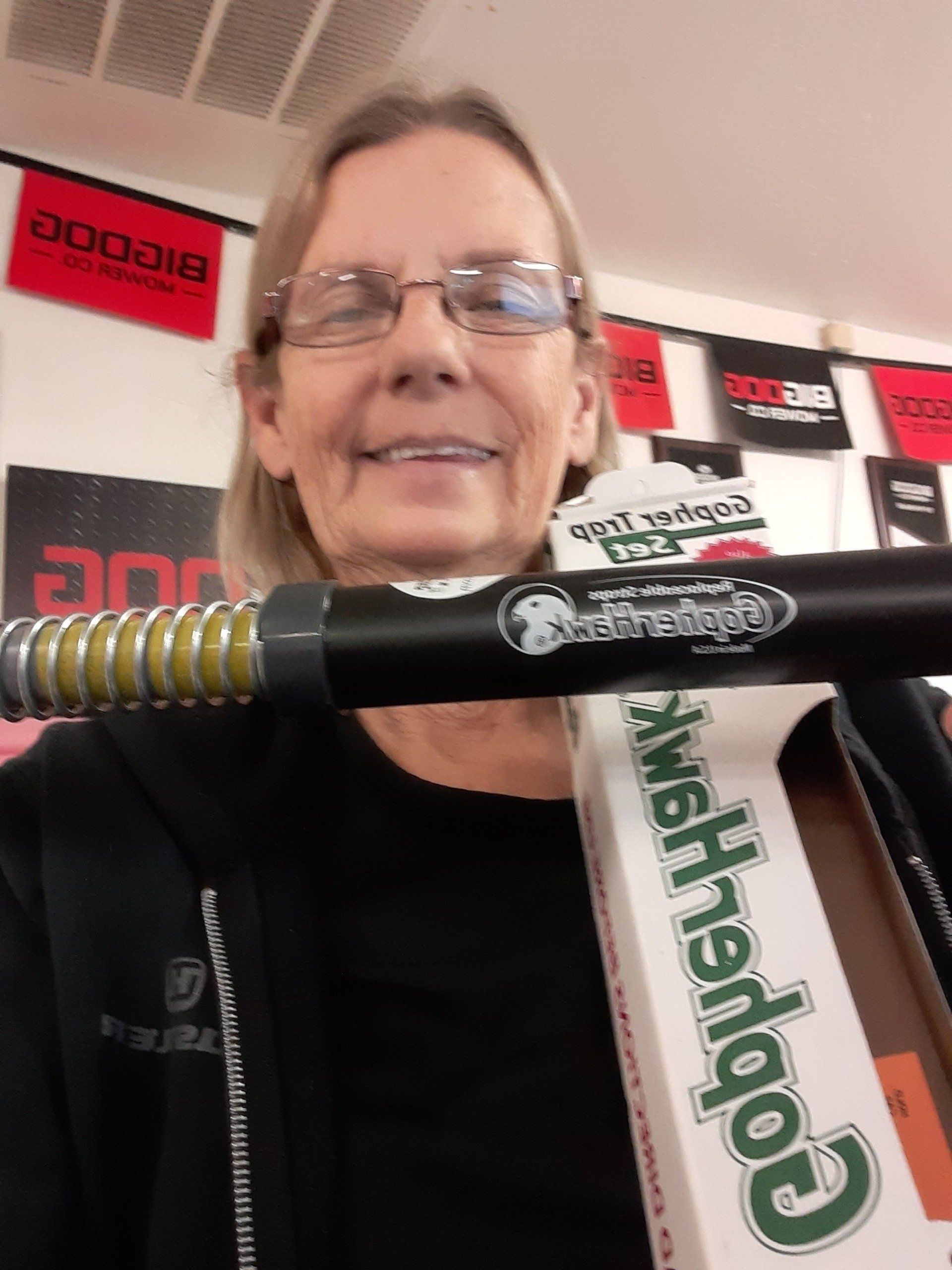 Cindy Rogers showing off a Gopher Hawk trap set