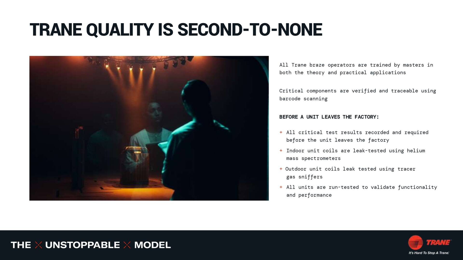 A stage with spotlights and two men with a backdrop. Text: 