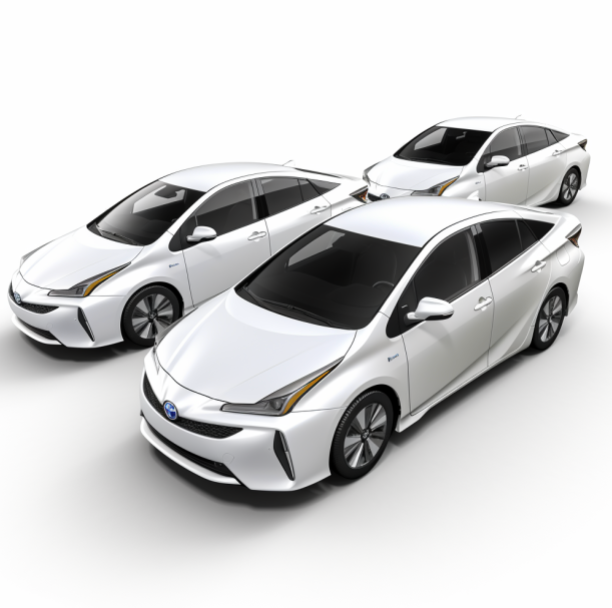 Three white cars are sitting next to each other on a white surface.