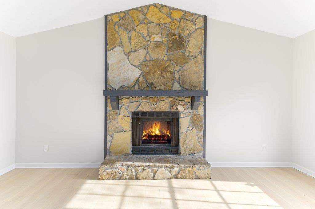 There is a fireplace in the middle of the room.