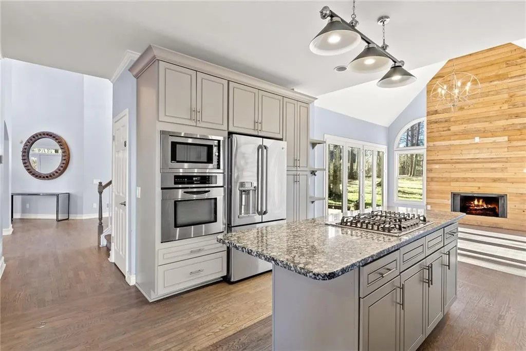 There is a large island in the middle of the kitchen.