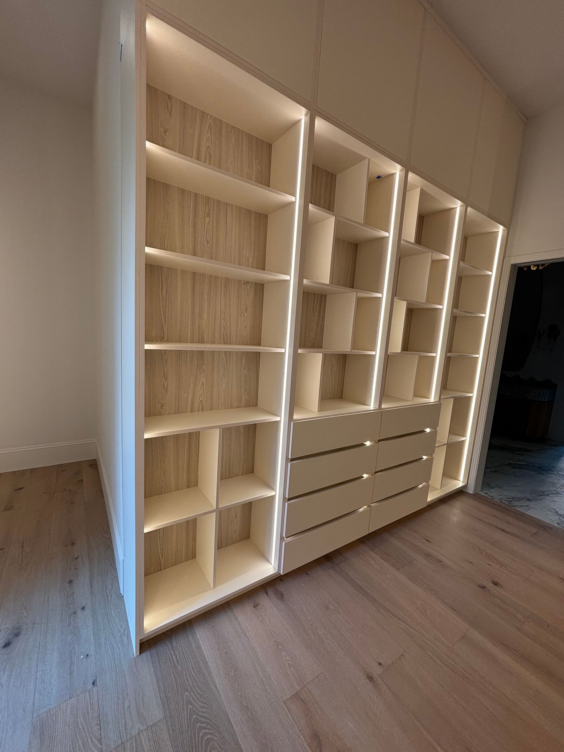 There are many shelves and drawers in this room.