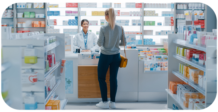 Woman Buying Medicines In Pharmacy