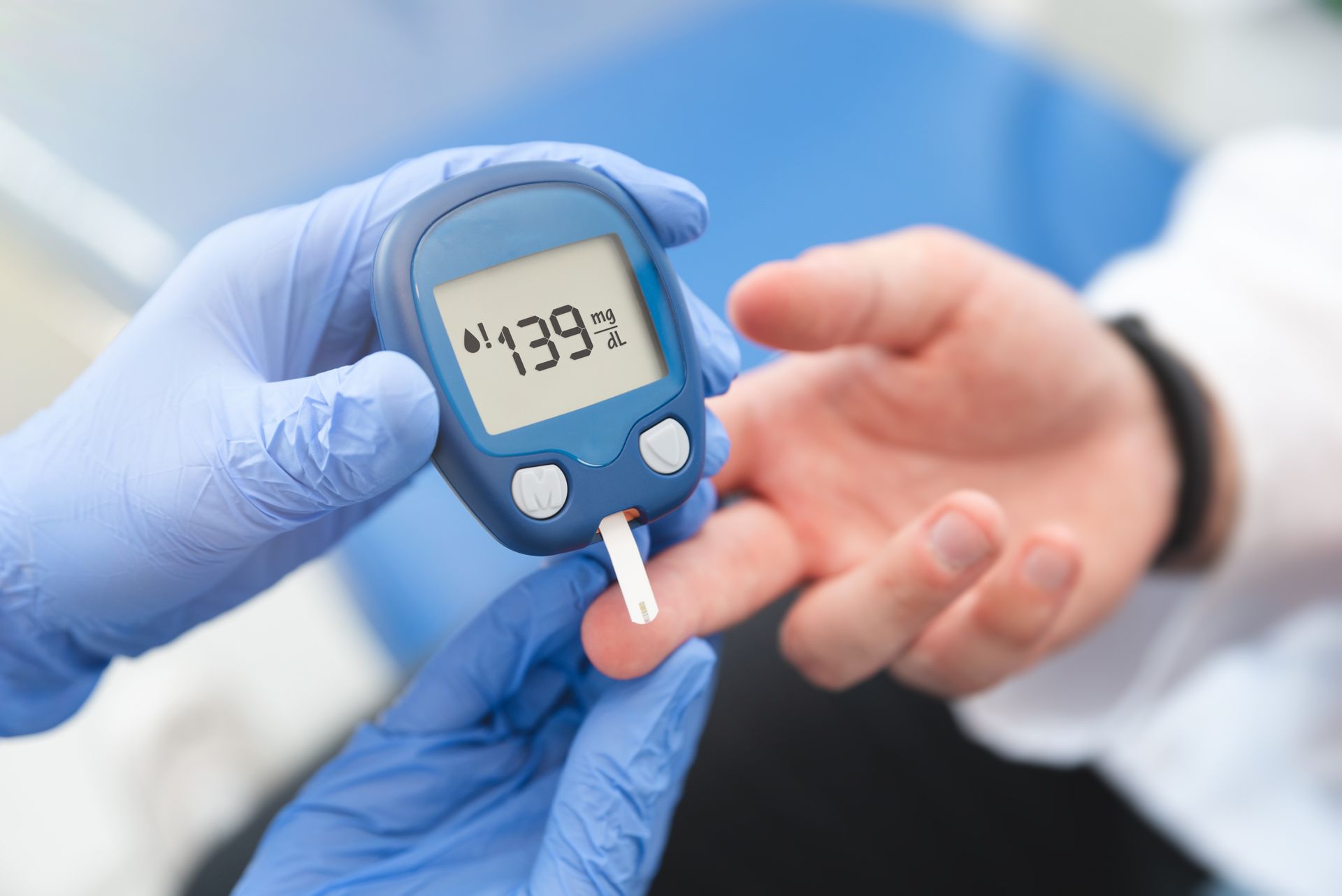 A person is being tested for diabetes by a doctor.