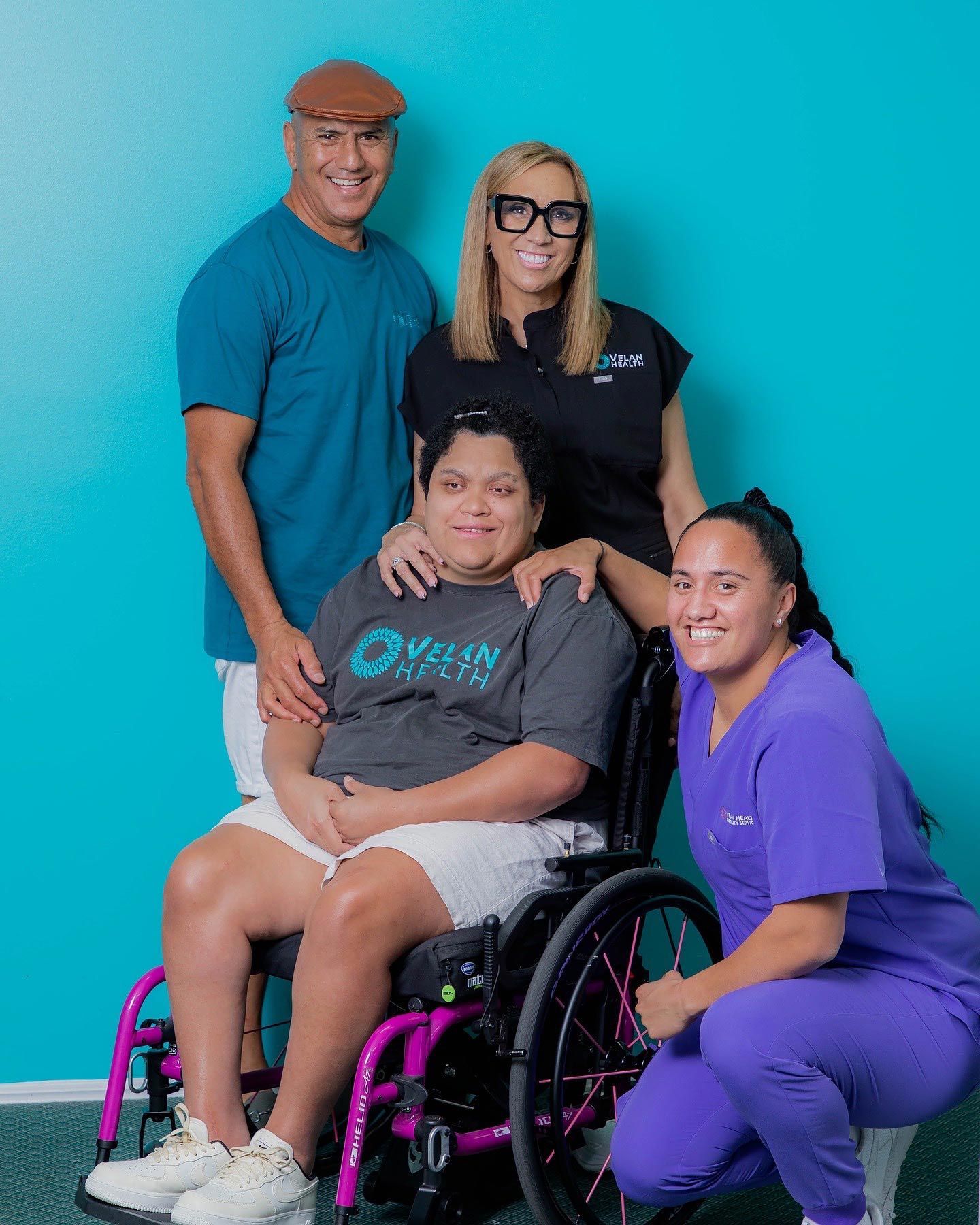 Velan Health Group With A Person On A Wheelchair — Velan Health In Burleigh Heads, QLD