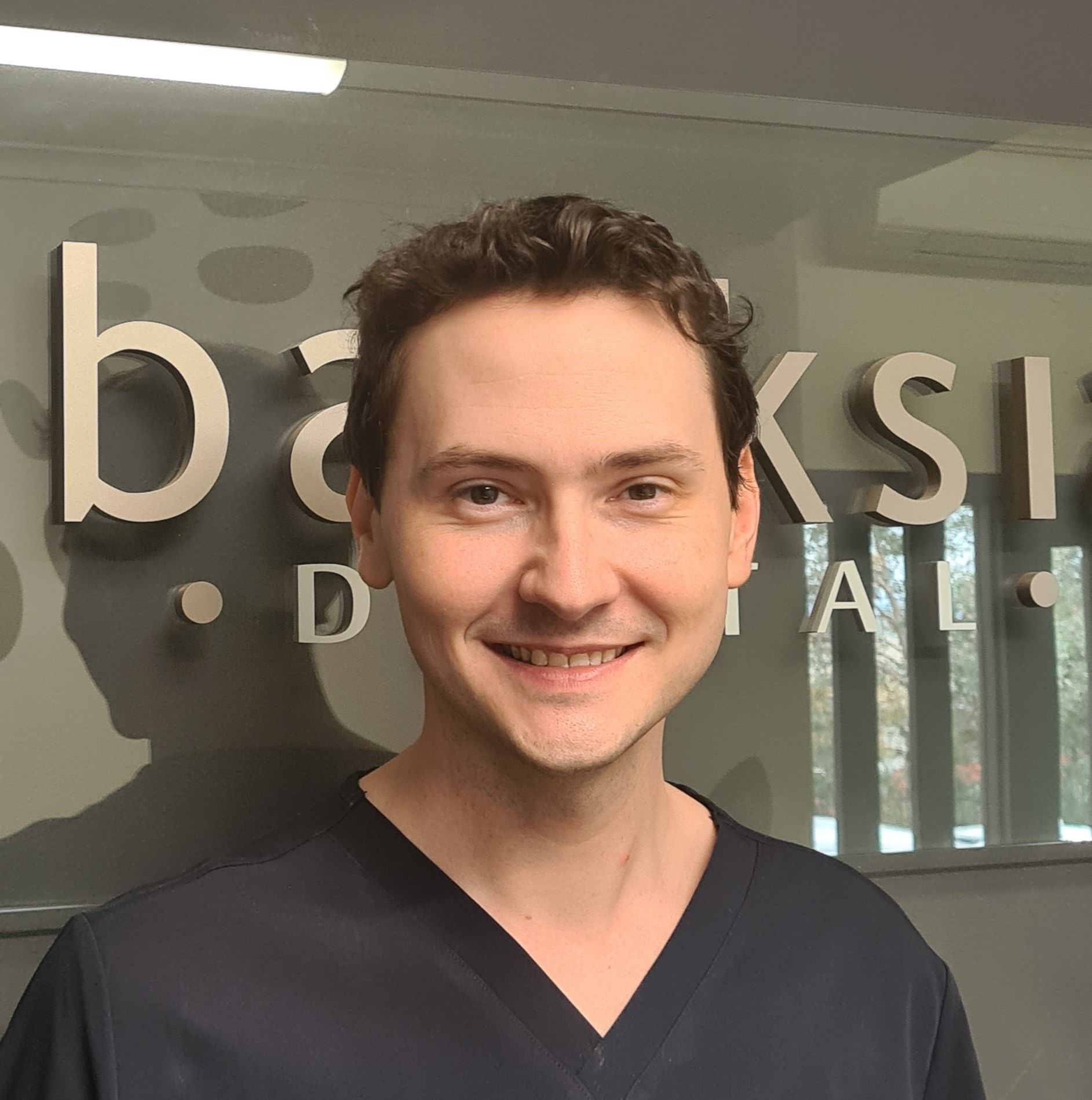 Silhouette of a person, consisting of a gray circle for the head and a rounded rectangle for the body.