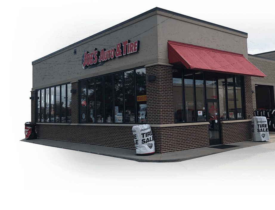 Exterior of a tire store with red awning and 
