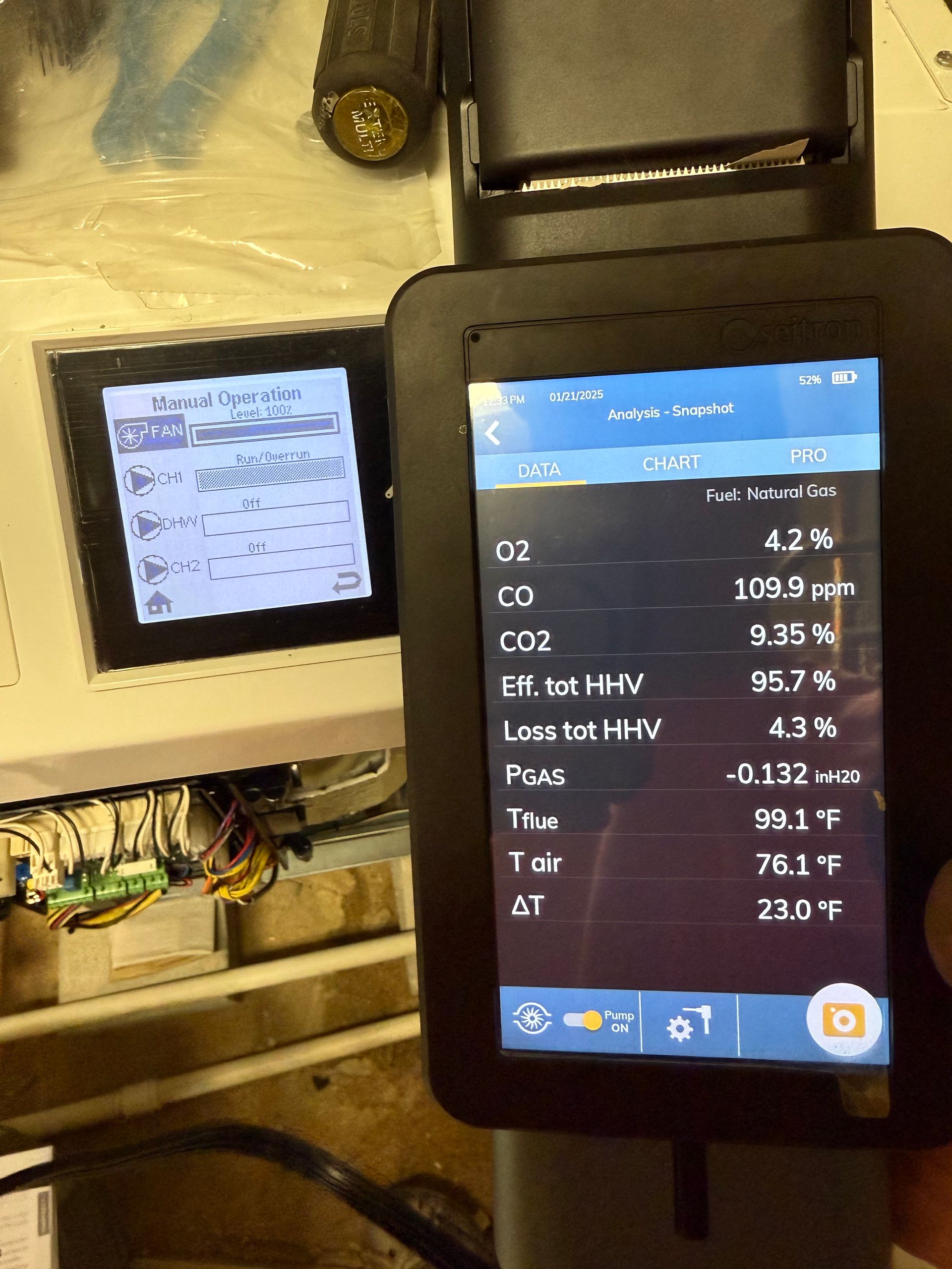 A person is holding a cell phone with a screen that says co2 on it