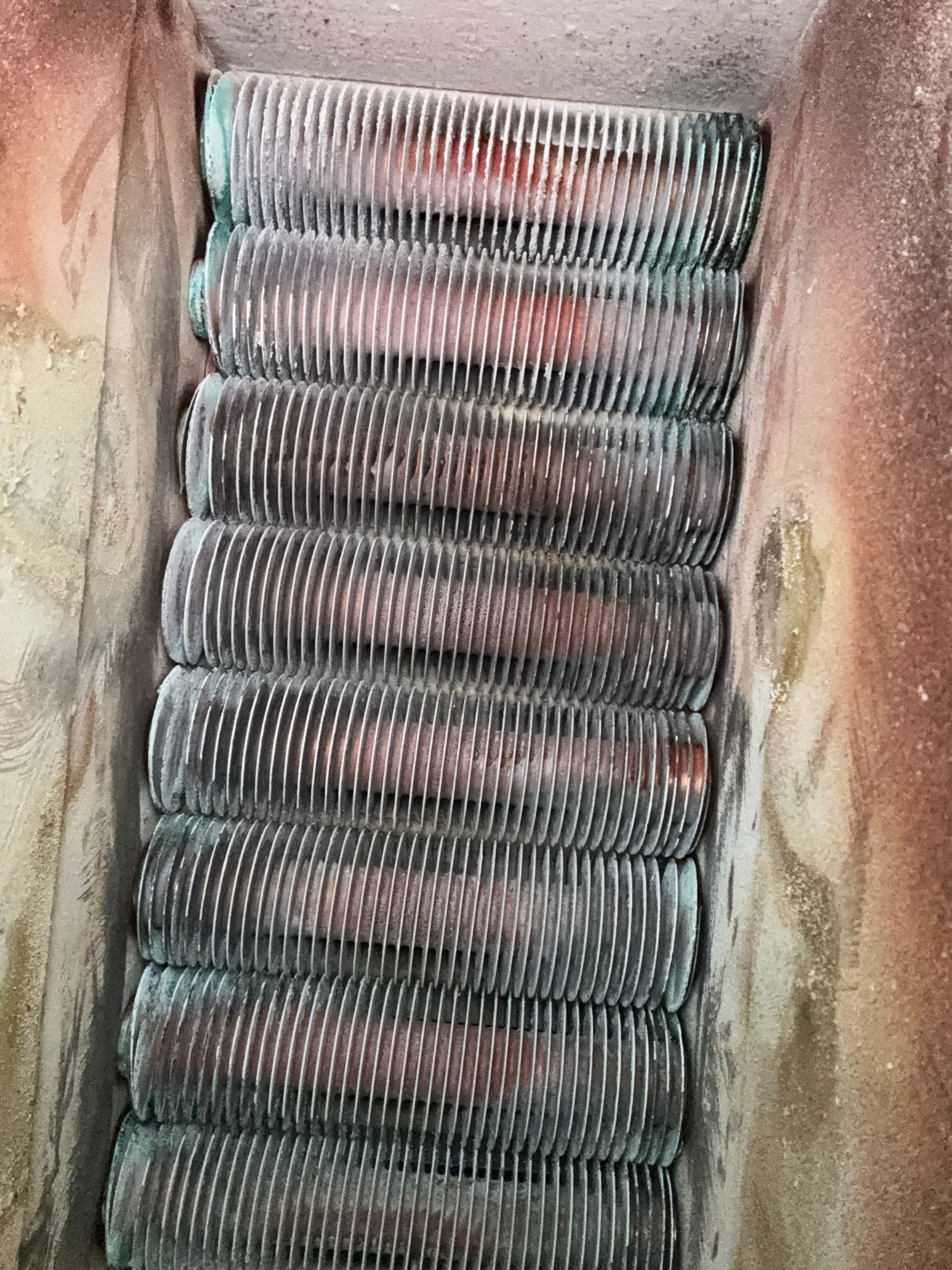 A close up of a radiator with a lot of wires coming out of it.