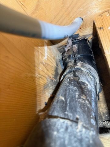 A close up of a pipe in a wooden box.