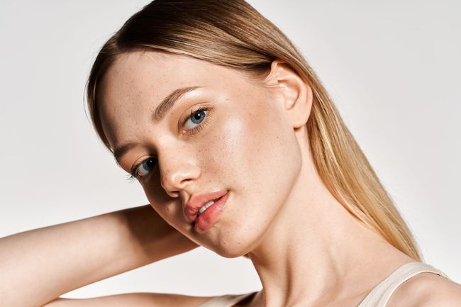 Woman with clear skin representing PRP microneedling and skin rejuvenation treatments