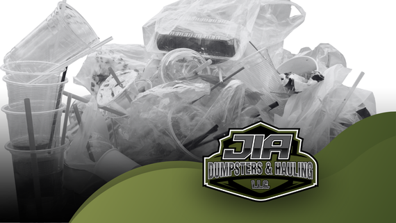 A pile of plastic garbage is sitting on top of a green surface.