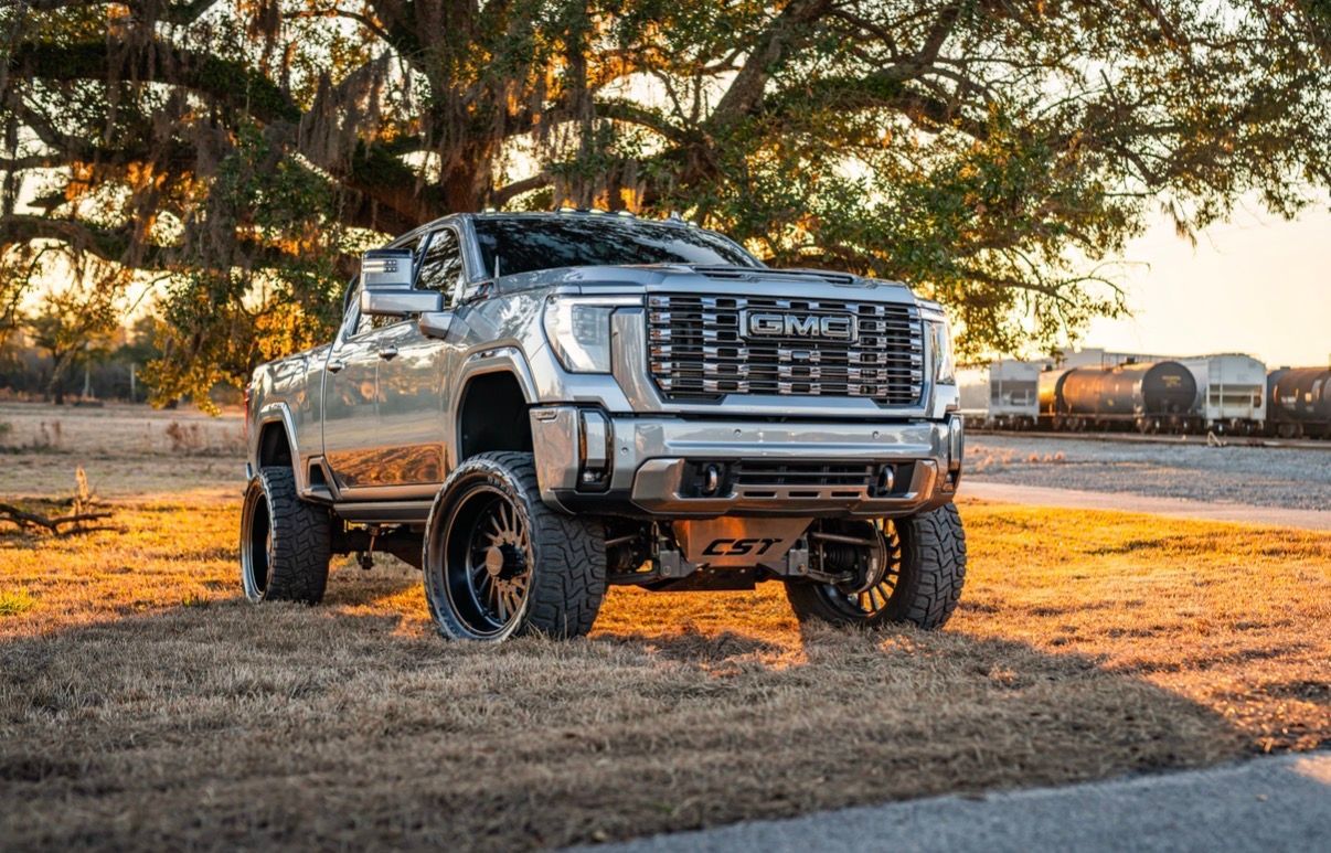 A white background with a dark gray to black gradient at the bottom Marshside Motors