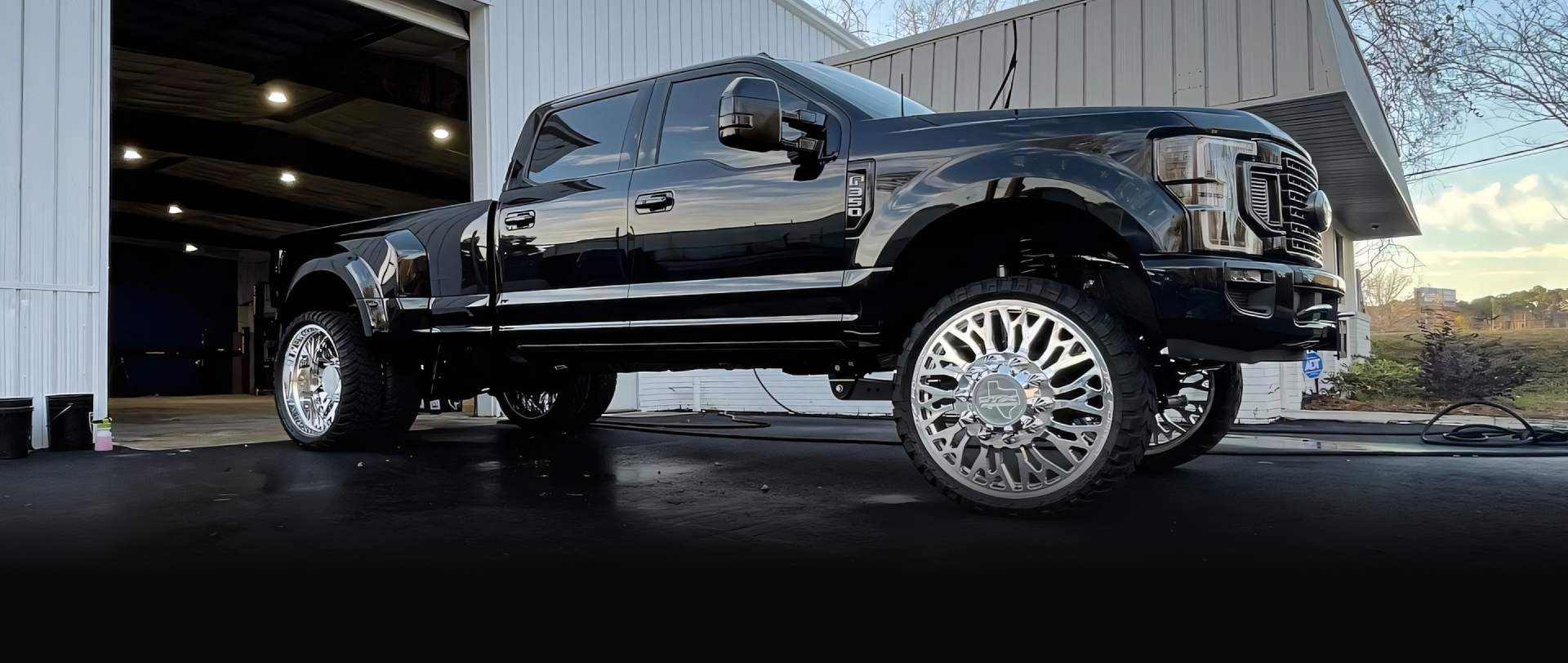 A white background with a dark gray to black gradient at the bottom Marshside Motors