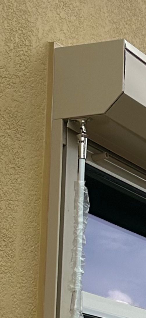 A close up of a window with a blind on it.