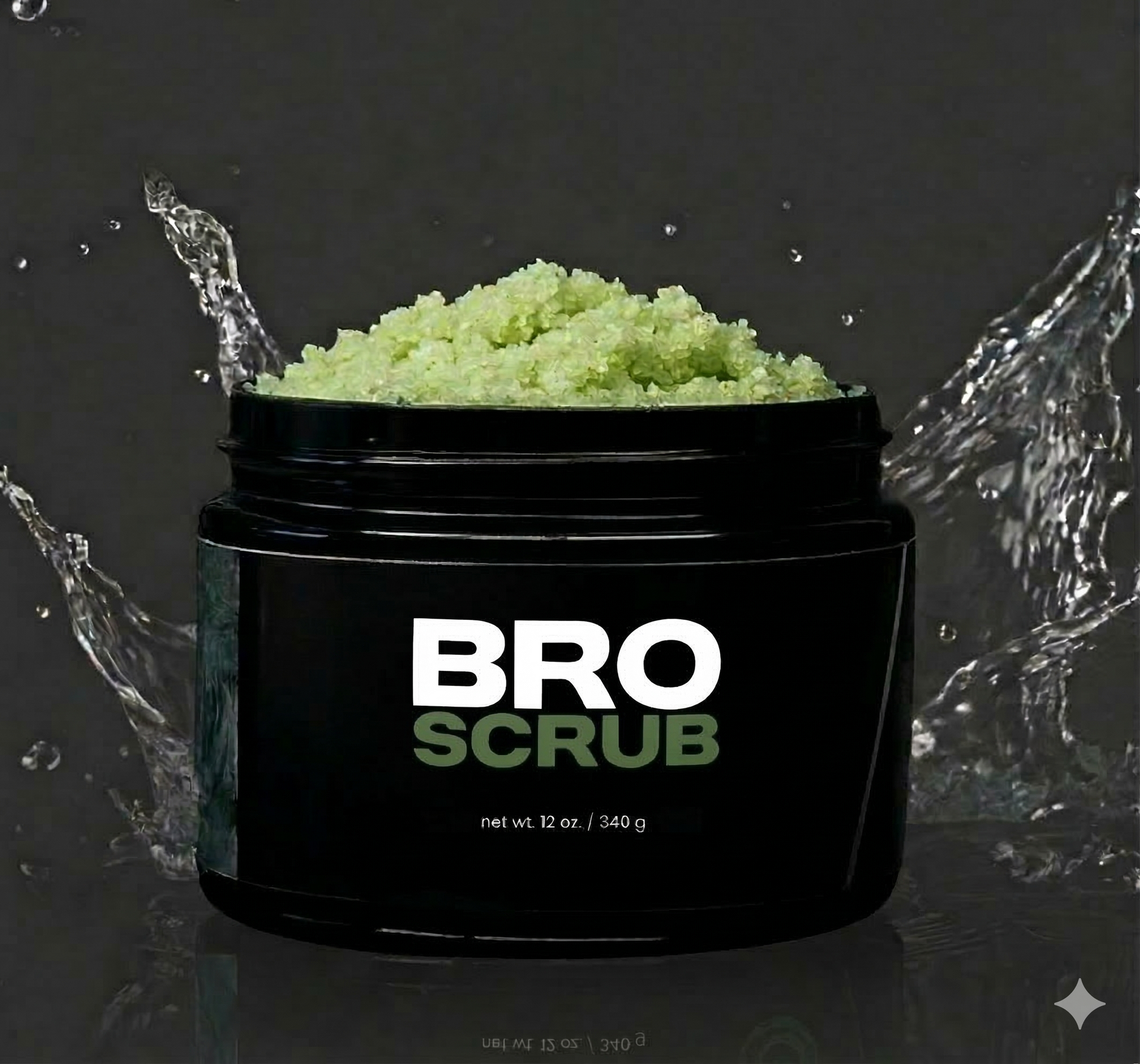 Black jar of BRO SCRUB with green scrub spilling out and water splashing on both sides.
